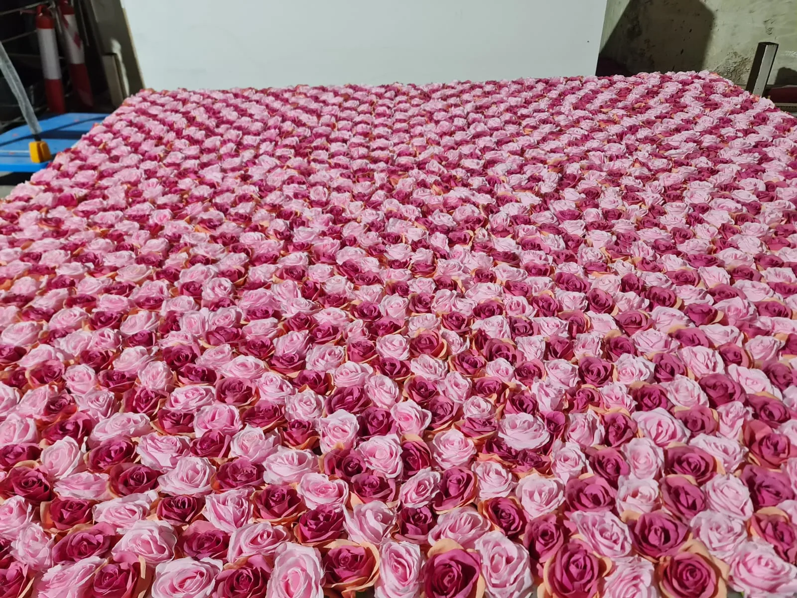 Real completed project: A modular rose wall panel prepared ahead of installation.