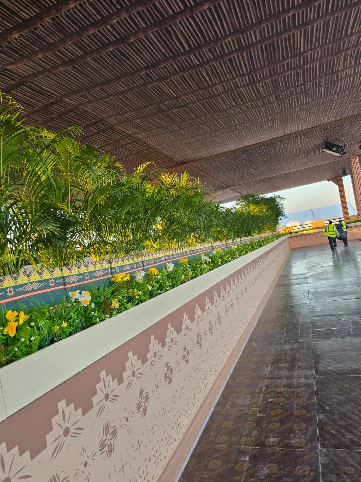 Real completed project: Planter and palm styling along the venue walkway.