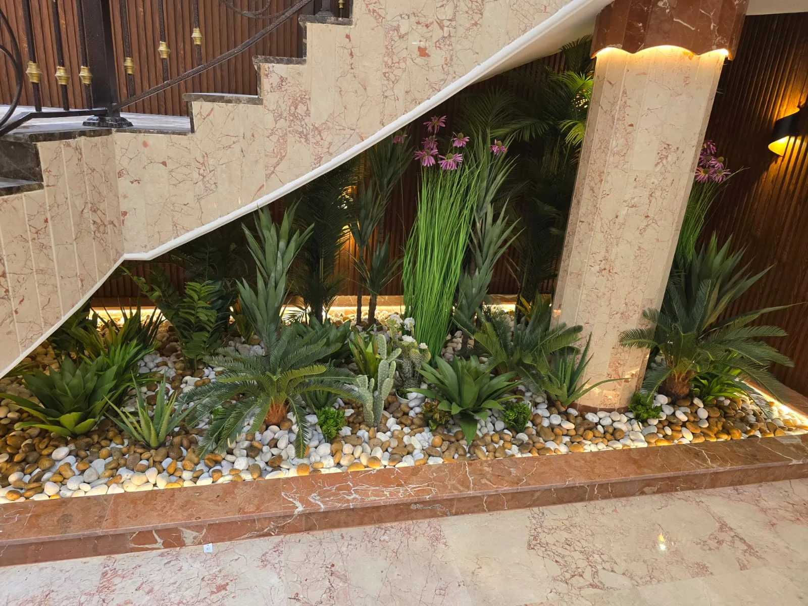 Real completed project: The finished planter bed — cacti, agave and ornamental grasses under the staircase.
